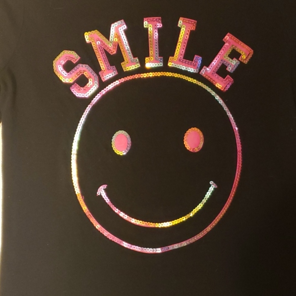 Black tee with iridescent sequin smiley face